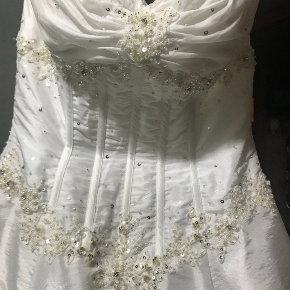A white grown perfect for wedding or a pageant